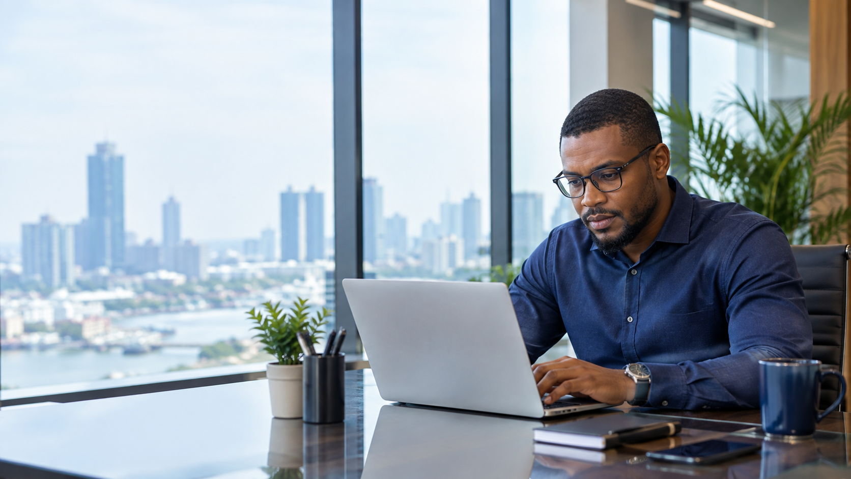 Business owner working on a laptop in a modern office
